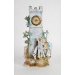 TINTED BISQUE CLOCK GROUP modelled as a young carter and horse in front of a castellated ruin, 16