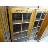 A VICTORIAN OAK DISPLAY CABINET, GLAZED DOORS ALL RAISED ON CABRIOLE SUPPORTS