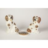 PARI OF STAFFORDSHIRE POTTERY MANTEL DOGS, modelled in typical pose, each with brown splashed coat