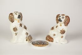 PARI OF STAFFORDSHIRE POTTERY MANTEL DOGS, modelled in typical pose, each with brown splashed coat
