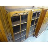 AN OAK TWO TIER BOOK TABLE/ COFFEE TABLE WITH CANTED CORNERS