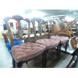 A SET OF FIVE VICTORIAN CARVED WALNUTWOOD SINGLE CHAIRS, WITH BUTTONED PINK VELVET SEAT, ON TURNED