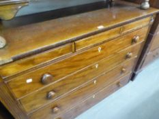 AN EARLY VICTORIAN MAHOGANY CHEST WITH THREE SHALLOW FRIEZE DRAWERS, OVER FOUR GRADUATED LONG