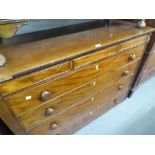 AN EARLY VICTORIAN MAHOGANY CHEST WITH THREE SHALLOW FRIEZE DRAWERS, OVER FOUR GRADUATED LONG