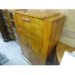 AN ART DECO FIGURED WALNUTWOOD COCKTAIL CABINET