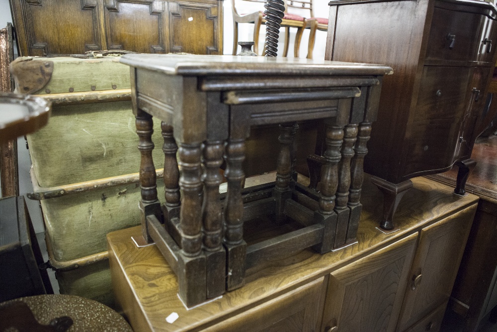 A NEST OF THREE OAK COFFEE TABLES