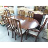 A REPRODUCTION DARK MAHOGANY DINING TABLE AND SIX CHAIRS (4+2)