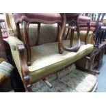 AN EARLY TWENTIETH CENTURY CARVED WALNUTWOOD FRAMED WINGED DRAWING ROOM SETTEE, ON TURNED FRONT