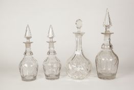 NINE CUT GLASS DECANTERS, WITH STOPPERS, including; A PART SUITE OF FIVE (one with matched