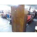 A VICTORIAN WALNUT BEDROOM SUITE COMPRISING; DRESSING TABLE WITH SHAPED TRIPLE MIRROR AND WARDROBE