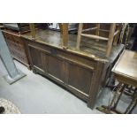 ANTIQUE CARVED OAK DOWER CHEST WITH PLANK TOP AND THREE PANEL FRONT, ORIGINAL WROUGHT METAL LOCK (