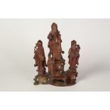 CHINESE CARVED SOAPSTONE GROUP, modelled as four immortals standing on rockwork, 10 1/2" (26.7cm)
