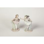 PAIR OF NAO, SPANISH PORCELAIN FIGURES OF YOUNG BALLERINAS, modelled standing in stylized poses,