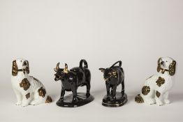A PAIR OF SMALL VICTORIAN STAFFORDSHIRE POTTERY MANTEL SHELF DOGS, with copper lustre markings, with