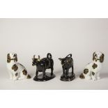 A PAIR OF SMALL VICTORIAN STAFFORDSHIRE POTTERY MANTEL SHELF DOGS, with copper lustre markings, with