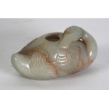 A GOOD CHINESE QING DYNASTY PALE CELADON JADE CARVING with russet inclusions, in the form of an