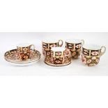 FIVE ROYAL CROWN DERBY JAPAN PATTERN CHINA CUPS AND SAUCERS pattern no. 2451 comprising a pair of