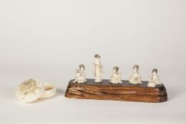 A SUITE OF FIVE SMALL EARLY 20TH CENTURY JAPANESE CARVED IVORY FIGURES OF GEISHAS seated playing