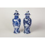 PAIR OF CHINESE BLUE AND WHITE PORCELAIN VASES AND COVERS, each of ovoid form with Dog of Fo pattern