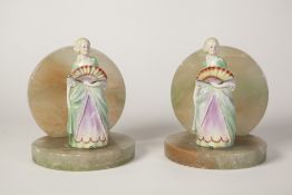 A PAIR OF 1930's GREEN ONYX AND PORCELAIN FIGURE BOOKENDS