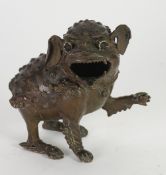 ORIENTAL PATINATED BRONZE MODEL OF A DOG OF FO modelled with front left paw raised, 6" (15.2cm)