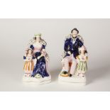 A PAIR OF VICTORIAN STAFFORDSHIRE POTTERY MODELS OF QUEEN VICTORIA AND PRINCE ALBERT, she with