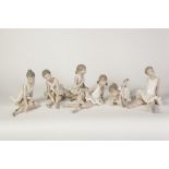 SIX NAO, SPANISH PORCELAIN FIGURES OF YOUNG BALLERINAS, modelled either seated of reclining, 6" (