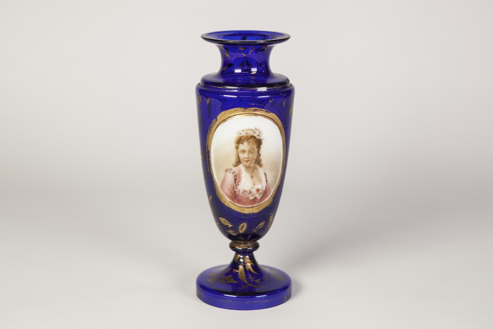 EARLY TWENTIETH CENTURY OVERLAID BLUE GLASS PEDESTAL VASE, of ovoid form with waisted neck, the gilt