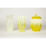 A VASELINE GLASS BISCUIT CONTAINER AND TWO SIMILAR VASES (3)