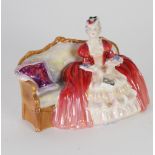 ROYAL DOULTON 'BELLE OF THE BALL' CHINA FIGURE HN 1997 modelled as a lady seated on a sofa, 6" (15.