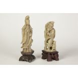TWO CHINESE CARVED GREEN SOAPSTONE FIGURES, one modelled a Guan Yin, the other as a fisherman with a