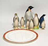 NINE POTTERY MODELS OF PENGUINS, including two Poole example, 8 3/4" (22.3cm) high and smaller,