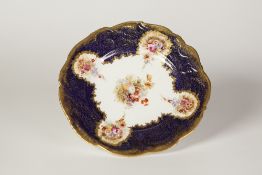 A VICTORIAN H.M. WILLIAMSON AND SONS PORCELAIN DESSERT PLATE, printed and enamelled with floral