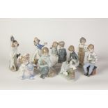 NINE NAO, SPANISH PORCELAIN FIGURES OF CHILDREN, including two modelled with rabbits, three modelled