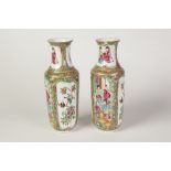 PAIR OF LATE NINETEENTH CENTURY CHINESE FAMILLE ROSE PORCELAIN VASES, each of footed cylindrical