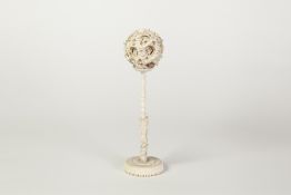 EARLY TWENTIETH CENTURY CHINESE CARVED IVORY CONCENTRIC BALL AND STAND, the ball of seven layers