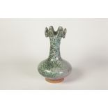 CHINESE POTTERY VASE, of compressed footed form with tall, waisted neck and wavy rim, glazed in