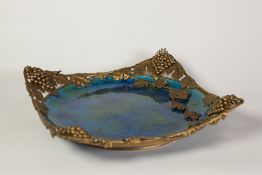 LATE NINETEENTH CENTURY 'SEVRES' FRENCH POTTERY FOOTED DISH, with ornate gilt metal mount, the