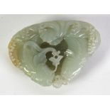 GOOD CHINESE QING DYNASTY CELADON JADE CARVING OF TWO CONFORMING CATFISH, in pursuit of a lotus