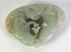 GOOD CHINESE QING DYNASTY CELADON JADE CARVING OF TWO CONFORMING CATFISH, in pursuit of a lotus