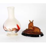 AMBER GLASS GROUP modelled as a recumbent deer with fawn, on a black glass oval chamfered base, 3