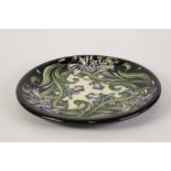 MODERN MOORCROFT 'IRIS' PATTERN TUBE LINED POTTERY PLAQUE, 10" (25.4cm) diameter, impressed