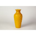 A CHINESE PEKING YELLOW GLASS SHOULDERED OVOID VASE, with waisted neck, the thick overlaid body