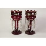 PAIR OF RUBY GLASS TABLE LUSTRES, of typical form, each with twelve prism cut glass drops in two