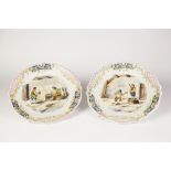 A PAIR OF NINETEENTH CENTURY CONTINENTAL FAIENCE POTTERY PLATES, Signed D.P. Teniers, each of cyma