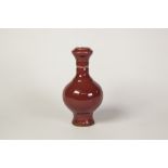 NINETEENTH/TWENTIETH CENTURY SANG D'BOUEF GLAZED PORCELAIN VASE, of baluster form with waisted and