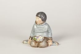 ROYAL COPENHAGEN 'GRONLAND' PORCELAIN FIGURE, modelled as a young girl, seated with a posy of