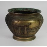 A JAPANESE MEIJI PERIOD PATINATED COPPER ALLOY JARDINIERE CAST WITH OPPOSING LANDSCAPE PANELS within