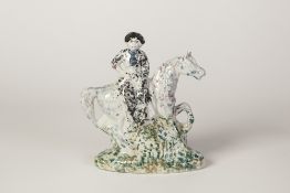 A SMALL NINETEENTH CENTURY POSSIBLY SCOTTISH HOLLOW SLIP-CAST FLAT-BACK MODEL OF A LADY, sat on