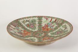 LATE 19th CENTURY CHINESE CANTON DECORATED SHALLOW DISH with figural and floriated panels in famille